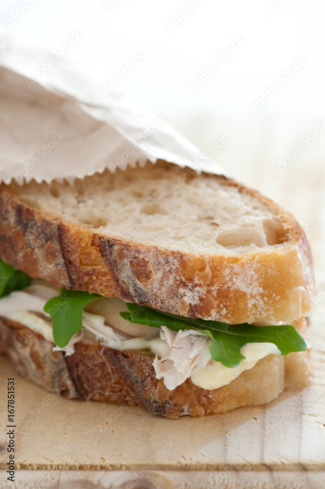 Chicken sandwich on wooden table Chicken sandwich on wooden table
