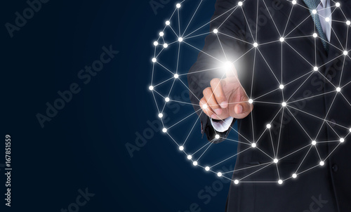 Businessman touching global network and connection data exchanges using digital tactile world interface with finger.