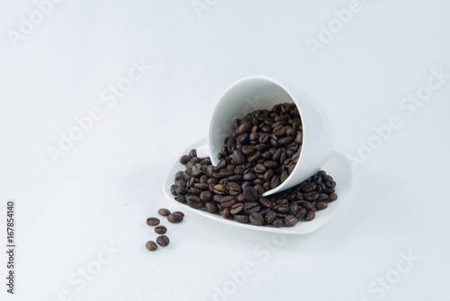 Cup of coffee on beans