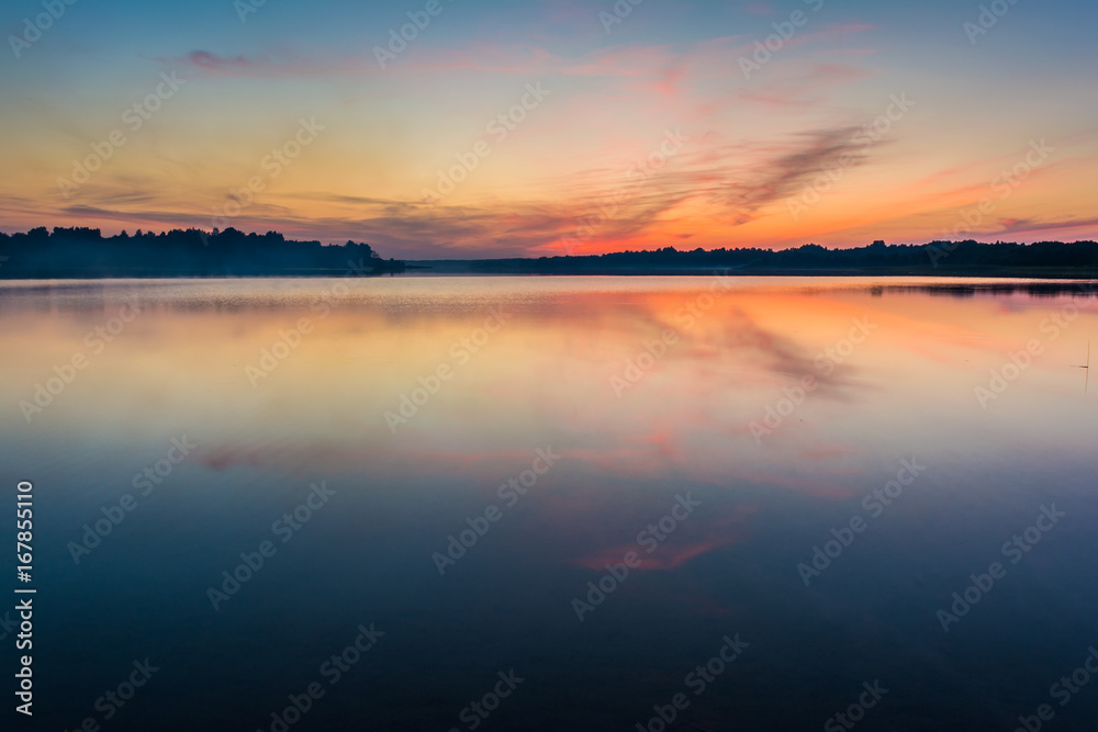 The sky and the lake in the twilight after sunset.