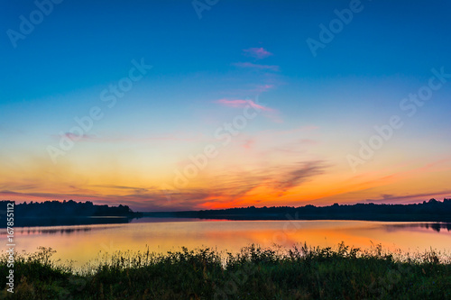 The sky and the lake in the twilight after sunset.