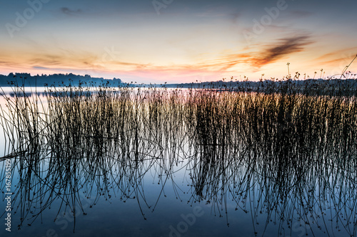 The sky and the lake in the twilight after sunset.