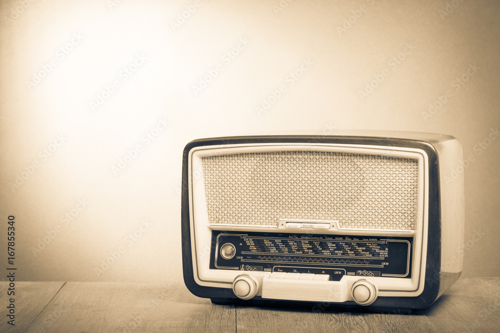 Retro old radio on table. Vintage style sepia photo Stock Photo | Adobe  Stock