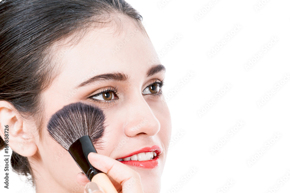 Stylist applying blusher to the beautiful woman Stylist applying blusher to the beautiful woman