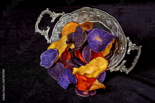 Crunchy appetizer of potato chips made from Crimson red, Purple photo