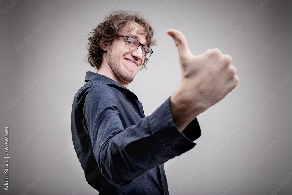 successful man portrait with a thumb up