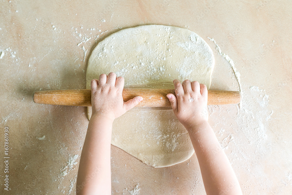 Children's hands rolled dough Children's hands rolled dough