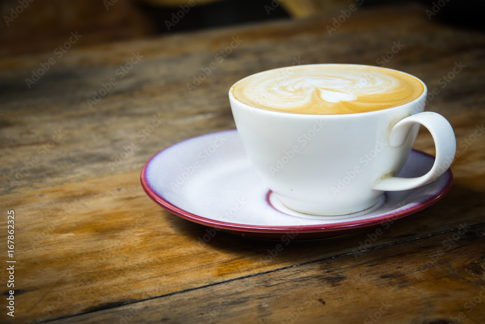 Top view of white coffee cup on wooden table for business and relaxing Top view of white coffee cup on wooden table for business and relaxing