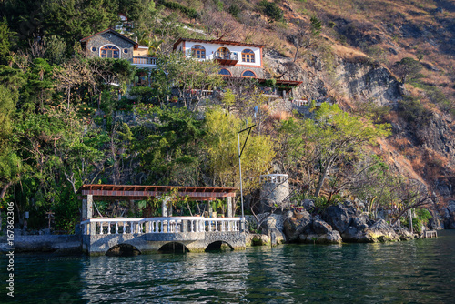 View from the lake of one of the picturesque cafe-restaurants on the shore of Lake Atitlan in Guatemala. 