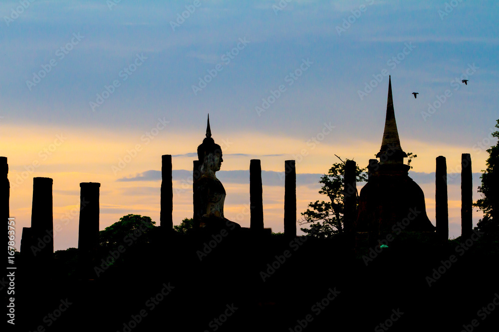 Sukhothai Historical Park with sihouette sunset in Thailand. Famous historical park in Thailand. Sunset at the park.