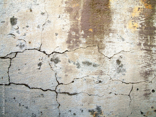 Old cracked wall of white color