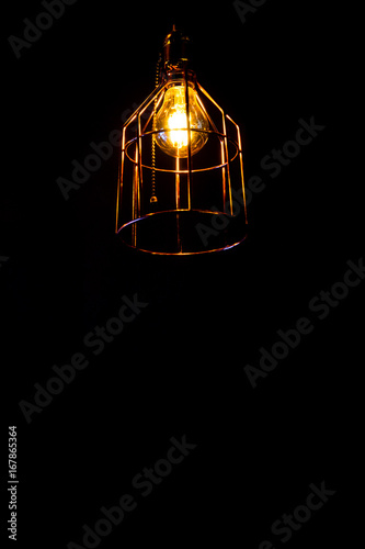 Luxury beautiful retro edison light lamp decoration in office or home. Interior decor with black background.