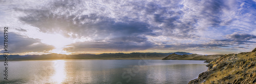 Fototapeta Naklejka Na Ścianę i Meble -  panoramic view rippled surface of cold sea at sunrise
