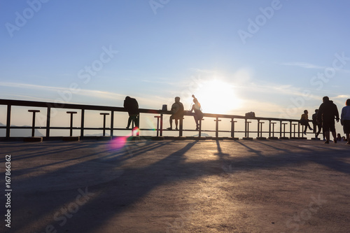 Many tourists watch the morning sunrise on the mountain.