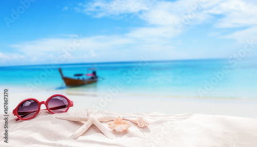 Fototapeta Naklejka Na Ścianę i Meble -  Summer vacation concept with accessories on sandy beach