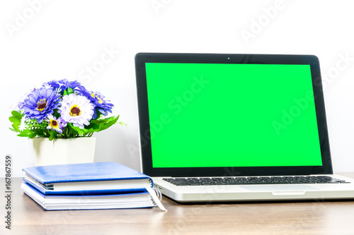 Laptop blank screen for text or pictures on wooden table. Concept for advertising  business and home office.