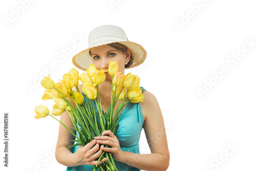 Woman in summer hat with a bouquet of tulips isolated on white background.