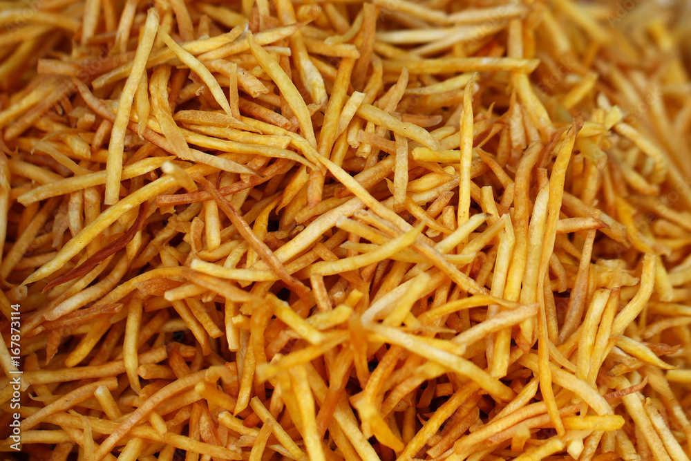 closeup group of French fries, potato, tiny slices, stick, chip, yellow crispy at asia fresh market , secret delicious recipe snack, backgrounds, wallpaper closeup group of French fries, potato, tiny slices, stick, chip, yellow crispy at asia fresh market , secret delicious recipe snack, backgrounds, wallpaper
