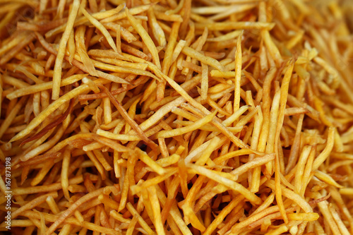 closeup group of French fries, potato, tiny slices, stick, chip, yellow crispy at asia fresh market , secret delicious recipe snack, backgrounds, wallpaper