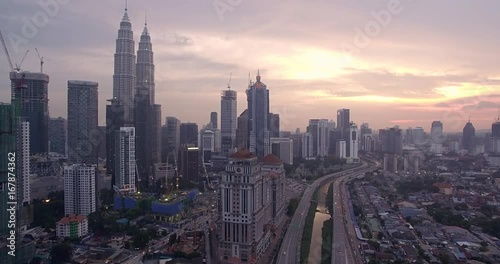 Skyscrapers in Kuala Lumpur City Center, Malaysia, at Sunset, Ascending Aerial Shot