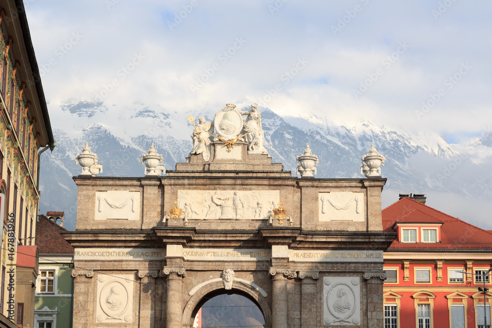 Triumphal Arch (Triumphpforte) and snow mountains in Innsbruck, Austria