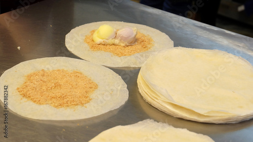 A Taiwan sweet desserts with crushed peanuts and ice-cream wrapped in a thin pancake crepe.
