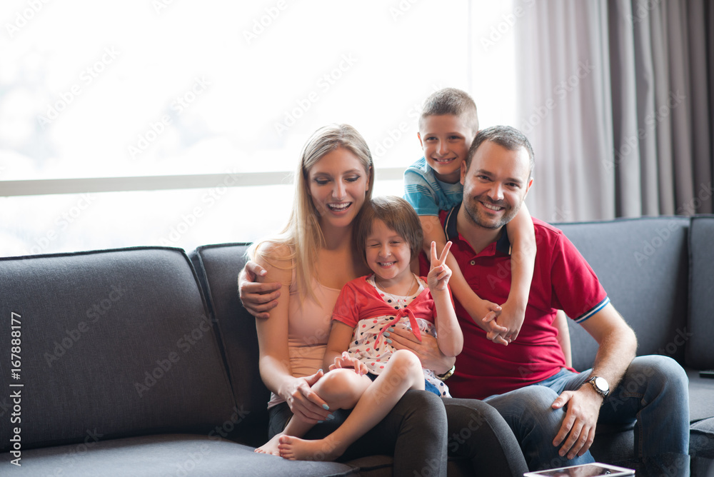 happy young couple spending time with kids happy young couple spending time with kids
