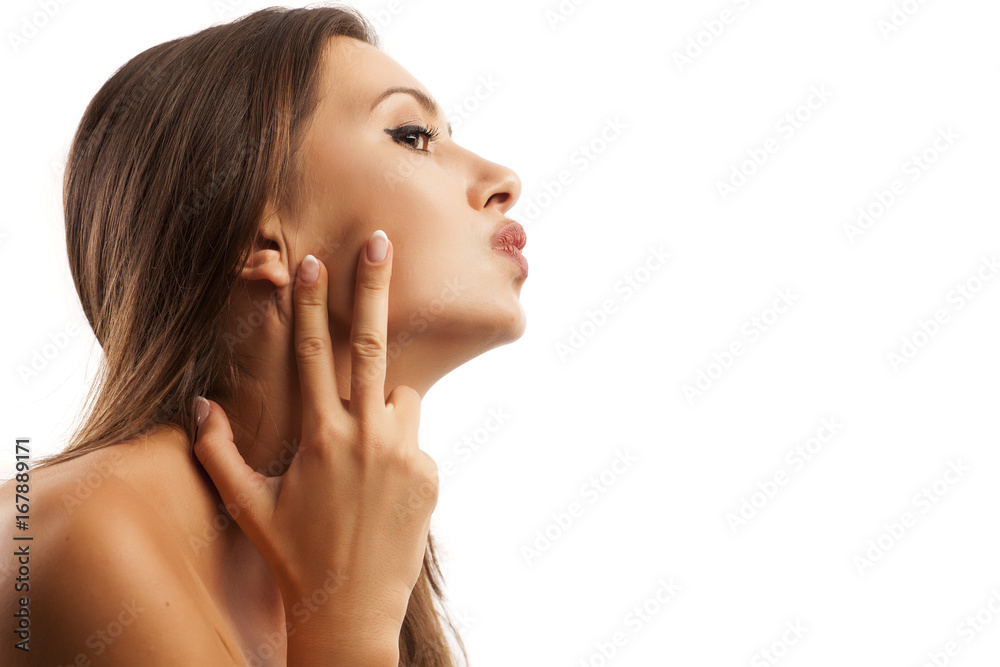 Beautiful young woman touching her chin