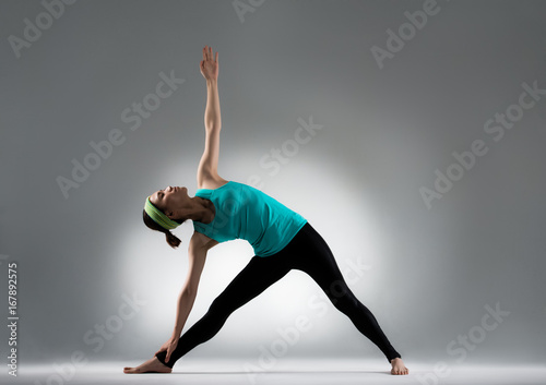 beautiful yoga player hold an ankle stretch body