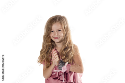 Beautiful smiling little girl praying - closeup portrait, isolated © Olga