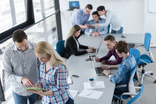 Two Business People Working With Tablet in office