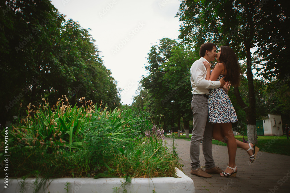 Fototapeta premium Beautiful young couple on a nature background