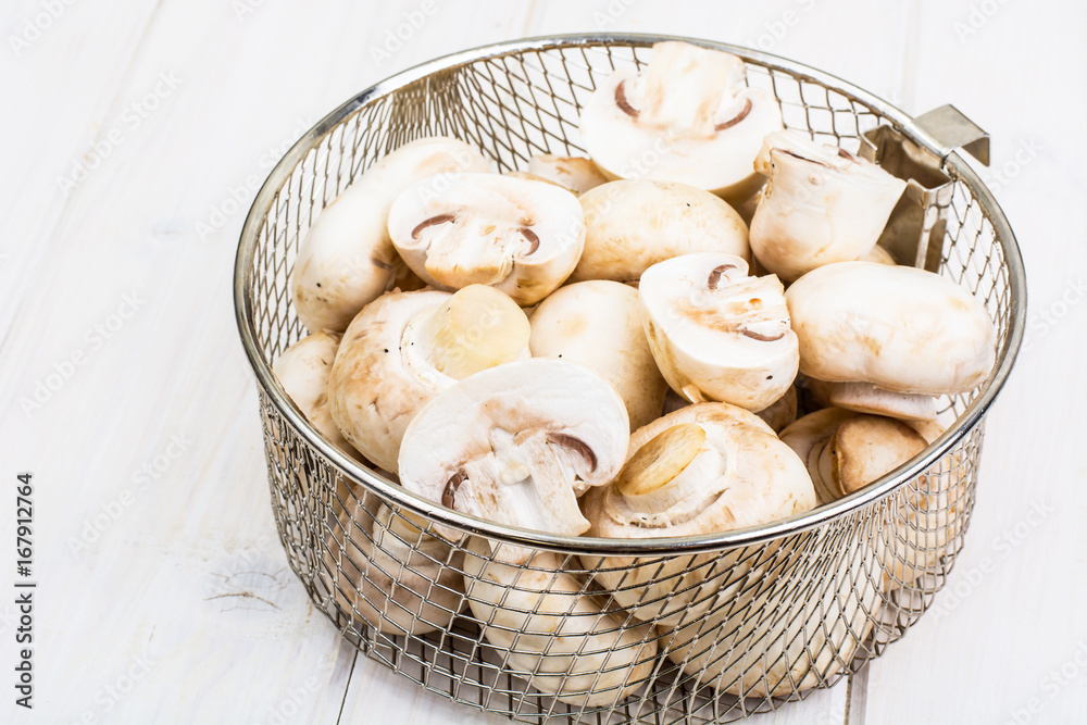 Fresh clean champignons for cooking Fresh clean champignons for cooking