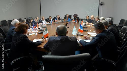 International negotiations for a round table. Statesman or politicians are seriously discussing the problem of ecology photo