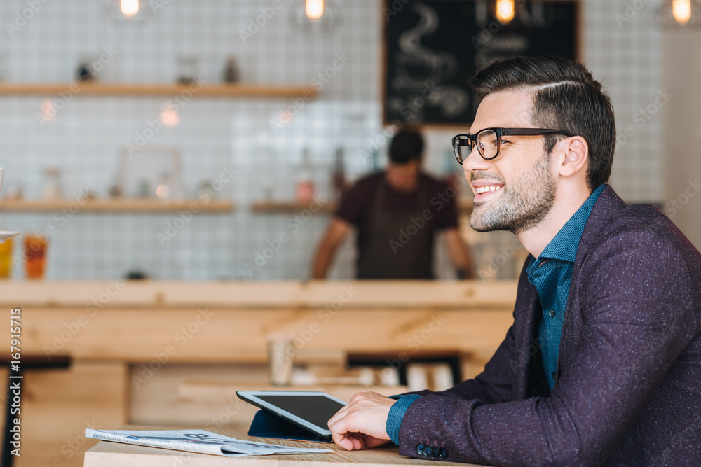 smiling businessman in cafe