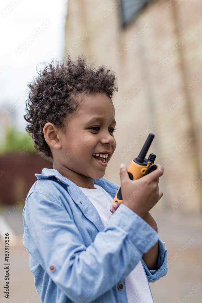 cute smiling afro boy with portable radio set cute smiling afro boy with portable radio set