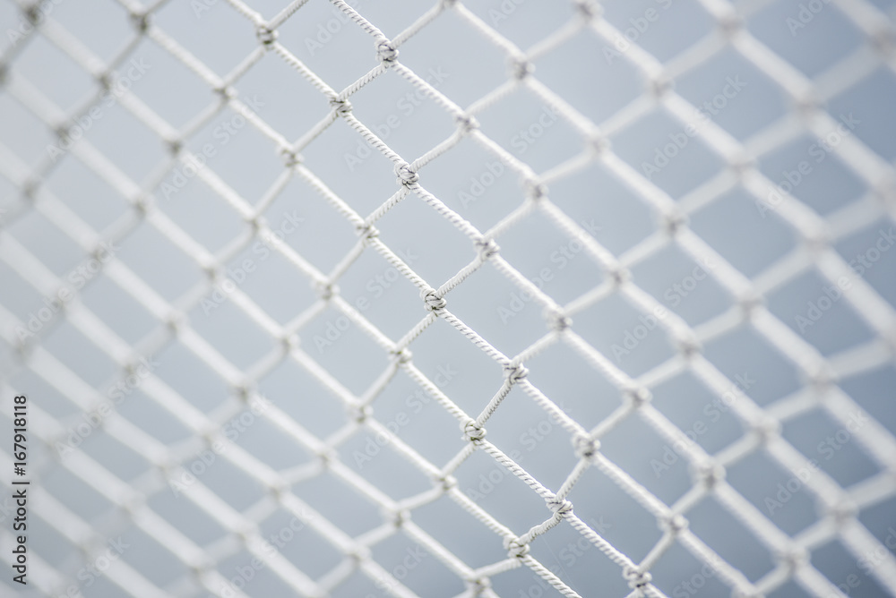 A material net that is a decoration on a yacht, performing protective functions. Texture or background. - obrazy, fototapety, plakaty 