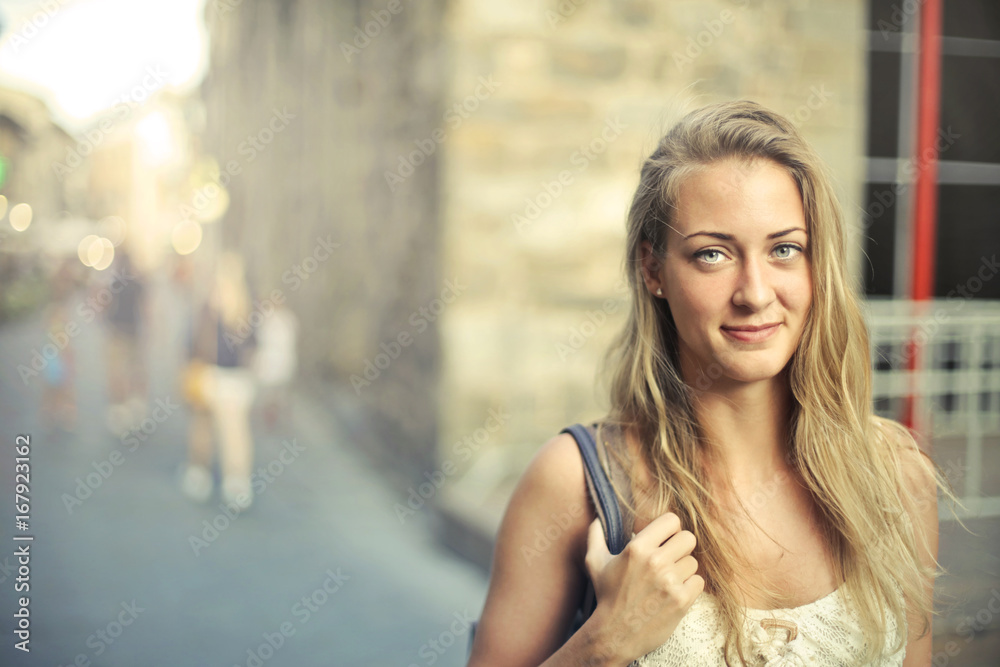 Portrait of beautiful young woman with blond hair and light blue eyes