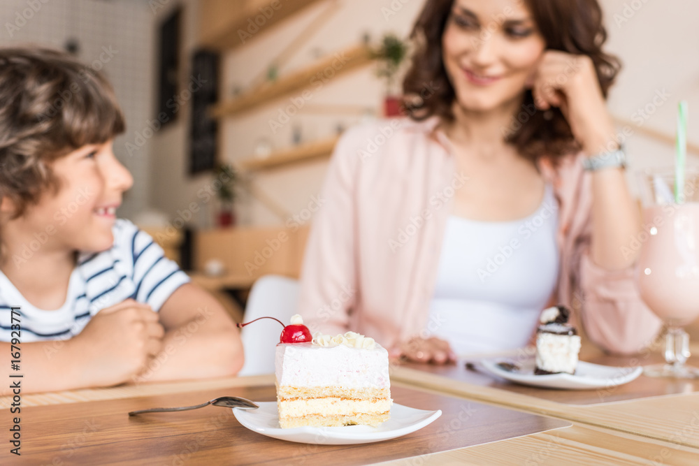 happy beautiful mother and son in cafe happy beautiful mother and son in cafe