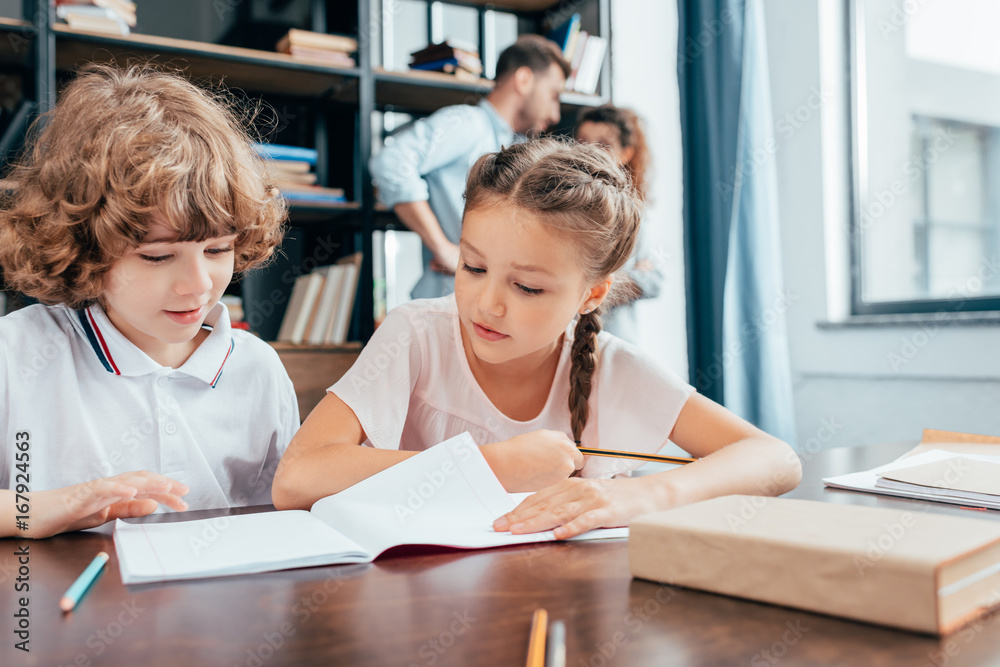 adorable little kids doing homework together adorable little kids doing homework together