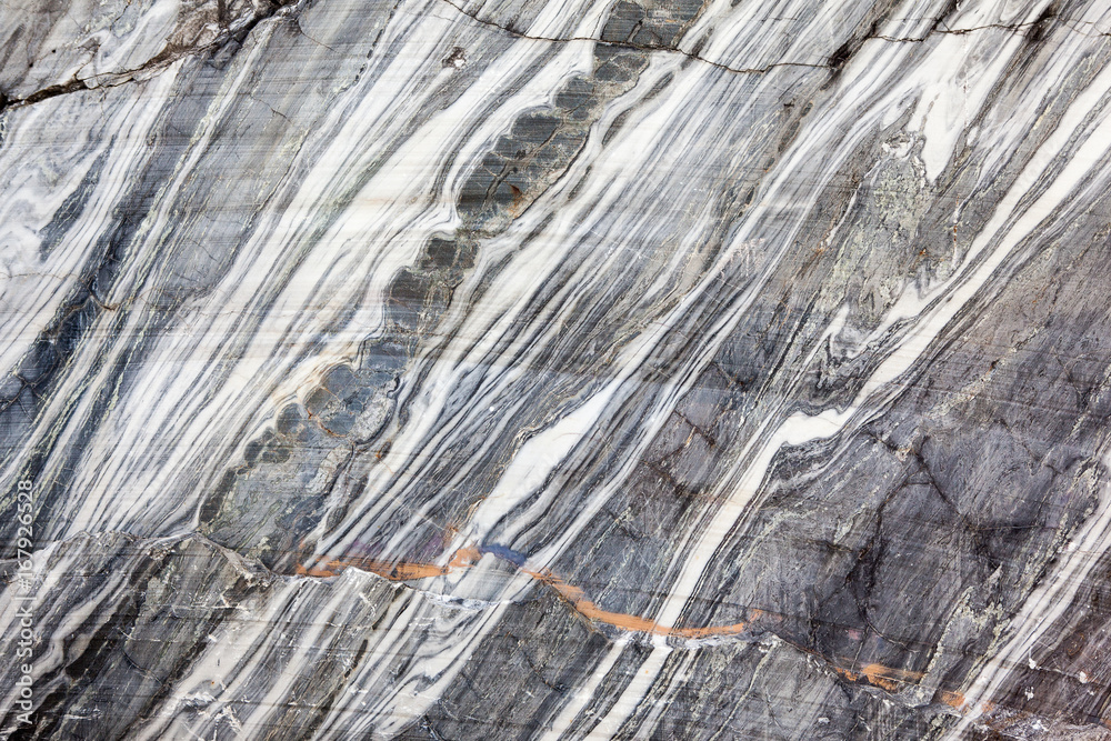 Fototapeta premium Stone background closeup texture. Focus on the pattern of the surface.
