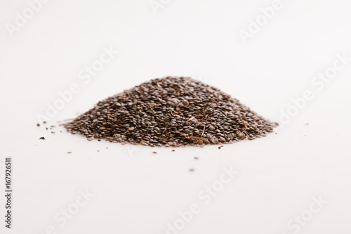 Nettle seeds on a white background.