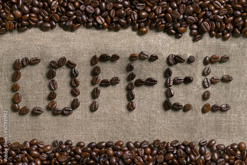 Inscription of coffee with coffee beans. photo