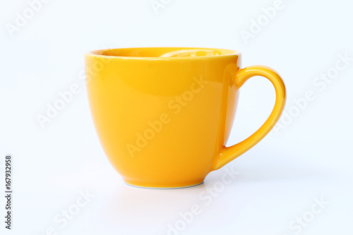 Valokuva Yellow coffee cup on White background.
