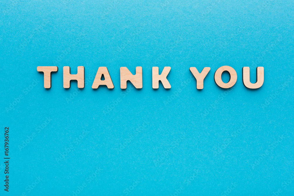Phrase Thank You on blue background Phrase Thank You on blue background