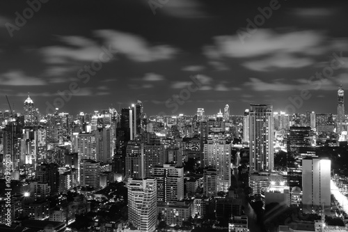 city skyline at night, cityscape background, long exposure technique for cloud movements