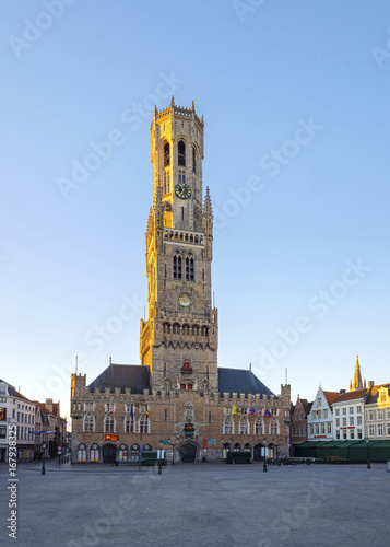 Belgium, West Flanders (Vlaanderen), Bruges (Brugge). The 13th century Belfort van Brugge belfry tower on the Markt square, at dawn.