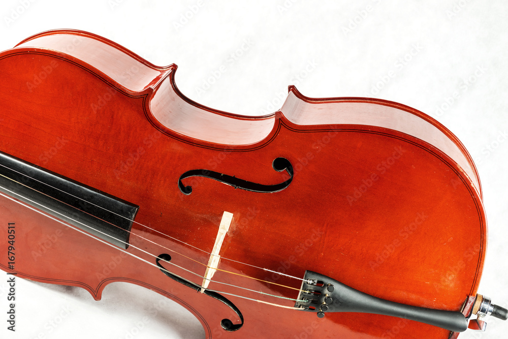 Old cello from which a fragment is seen