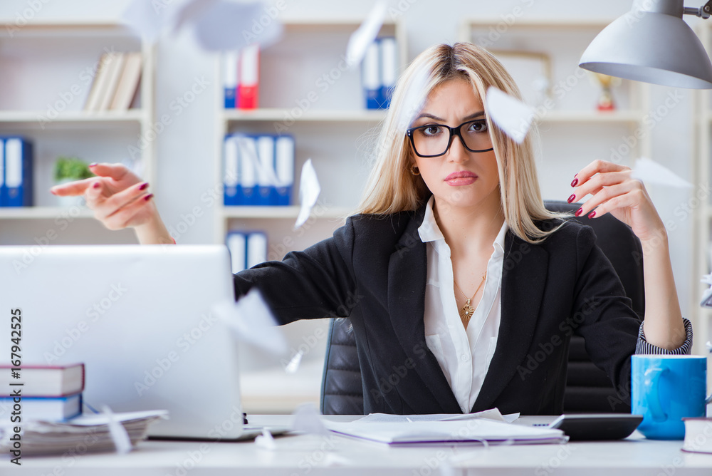Busineswoman frustrated working in the office Busineswoman frustrated working in the office