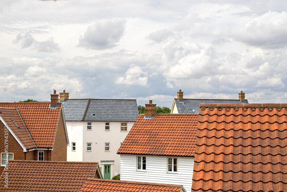 Real estate. Suburban property roof tops on a modern contemporary housing estate.